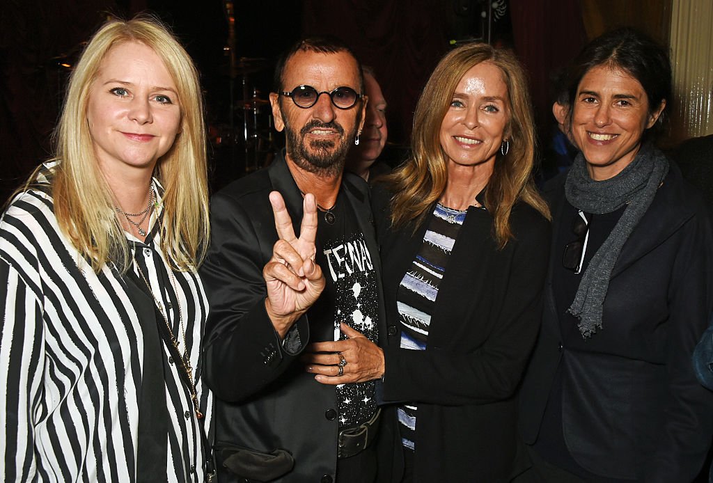 Image Credits: Getty Images / David M. Benett / Dave Benett | (L to R) Lee Starkey, Ringo Starr, Barbara Bach and Francesca Gregorini attend the launch of "Issues", a new album by SSHH in aid of Teenage Cancer Trust, at The Box on September 5, 2016 in London, England.