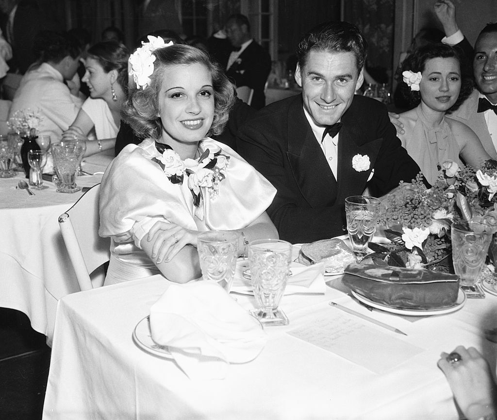 Image Source: Getty Images / Mrs. Errol Flynn (Lili Damita) Errol Flynn and Peggy Fears at the Miramar Hotel in Santa Monica.