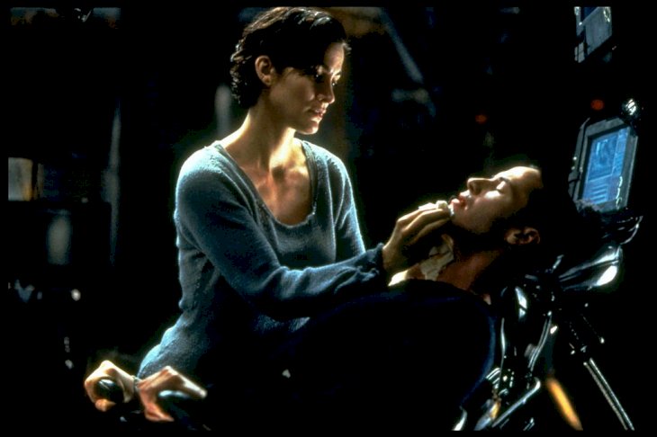Image Credit: Getty Images/Sygma via Getty Images/Sygma/Ronald Siemoneit | Carrie-Anne Moss and Keanu Reeves in The Matrix
