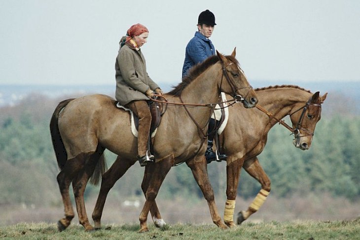 Image Credits: Getty Images / Tim Graham Photo Library | Princess Anne, the Princess Royal, and her husband Mark Phillips out exercising their horses at the Crookham Horse Trials, circa 1980. Image Credits: Getty Images / Tim Graham Photo Library | Princess Anne, the Princess Royal, and her husband Mark Phillips out exercising their horses at the Crookham Horse Trials, circa 1980.