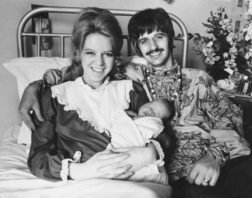 Image Credits: Getty Images / Keystone / Hulton Archive | Beatles drummer Ringo Starr with his wife Maureen and their new baby boy Jason at Queen Charlotte's Hospital, London, 21st August 1967.