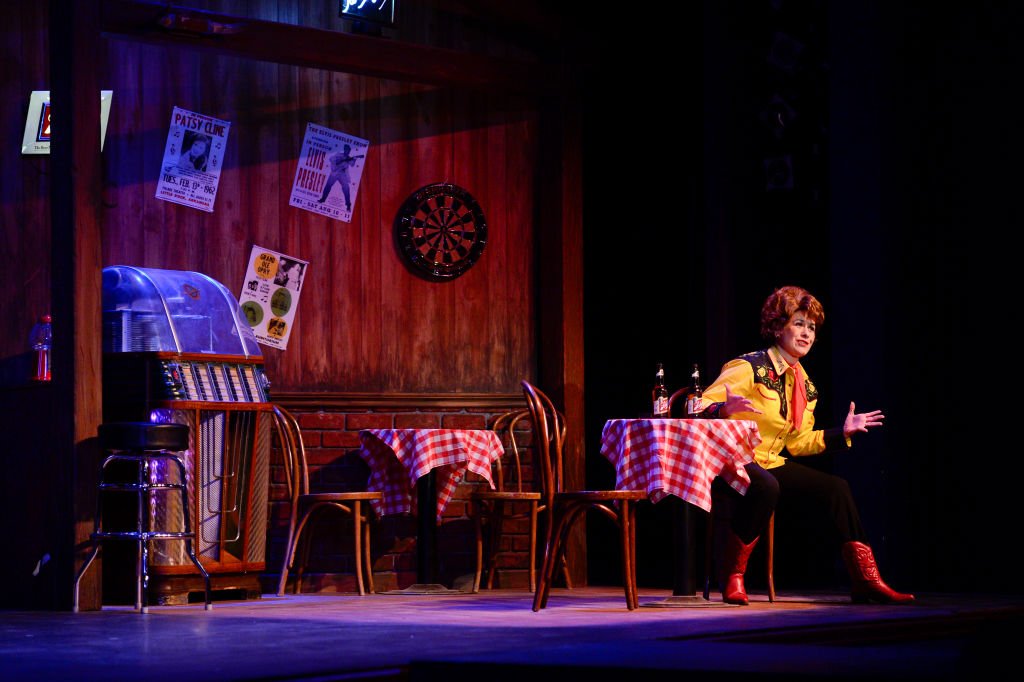 Image Credit: Getty Images / Alicia Dunfee, playing Louise Seger, acts during a performance of Always Patsy Cline on Thursday at the Candlelight Dinner Playhouse.