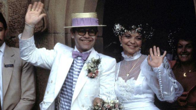 Image Credits: Getty Images / Elton John photographed with his former wife, Renate.