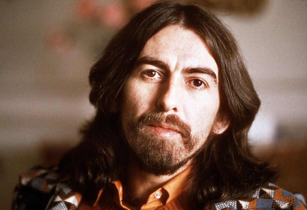 Image Credits: Getty Images / Michael Putland | English singer-songwriter, guitarist and former Beatle, George Harrison (1943 - 2001), Cannes, France, 30th January 1976. Harrison is in Cannes for the Midem music industry trade fair.