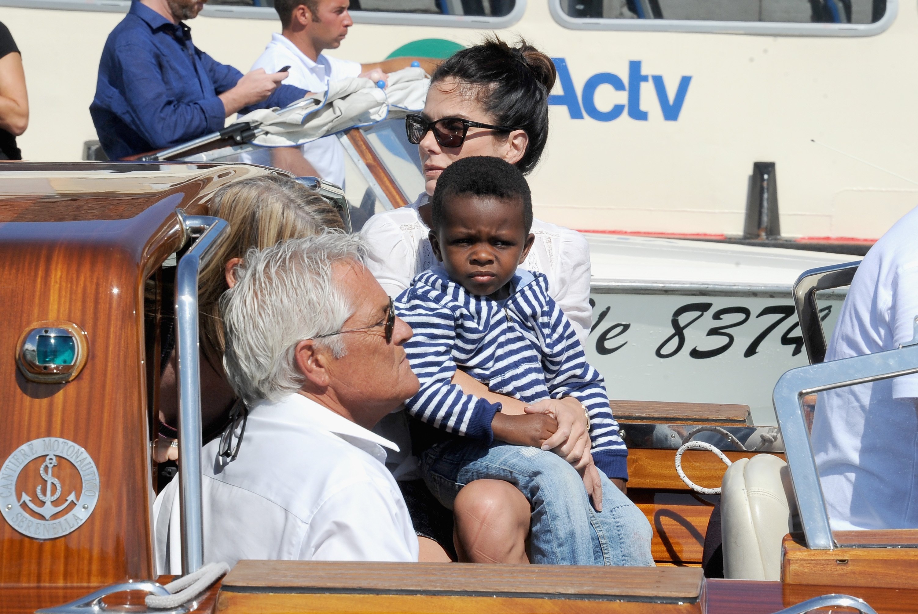 Image Credits: Getty Images / Jacopo Raule / FilmMagic | Actress Sandra Bullock and son Louis Bardo Bullock are seen during the 70th Venice International Film Festival on August 27, 2013 in Venice, Italy.