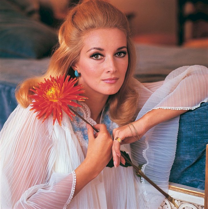 Image Credit: Getty Images / Daniela Bianchi holding a flower.