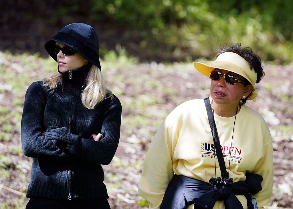 Image Credits: Getty Images / Donald Miralle | Tiger Woods' fiancee Elin Nordegren and his mother Kultida Woods looks on during the 3rd round of the WGC- Accenture Match Play Championship at the La Costa Resort and Spa on February 27, 2004 in Carlsbad, California. Image Credits: Getty Images / Donald Miralle | Tiger Woods' fiancee Elin Nordegren and his mother Kultida Woods looks on during the 3rd round of the WGC- Accenture Match Play Championship at the La Costa Resort and Spa on February 27, 2004 in Carlsbad, California.