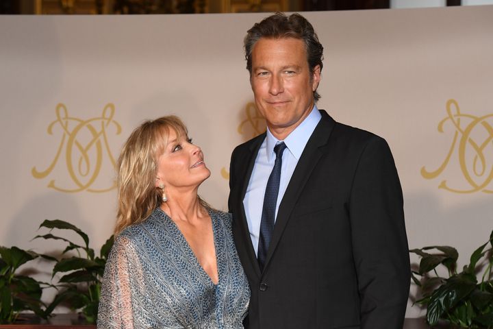 Image Credits: Getty Images / The model and Hollywood actor Bo Derek and John Corbett are photographed by the press.