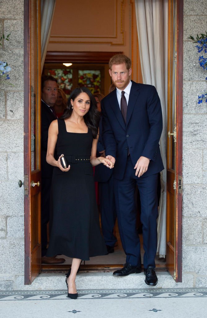 Image Credits: Getty Images / Geoff Pugh - WPA Pool | Prince Harry, Duke of Sussex and Meghan, Duchess of Sussex attend a reception at Glencairn, the residence of Robin Barnett, the British Ambassador to Ireland during day one of their visit to Ireland on July 10, 2018 in Dublin, Ireland.