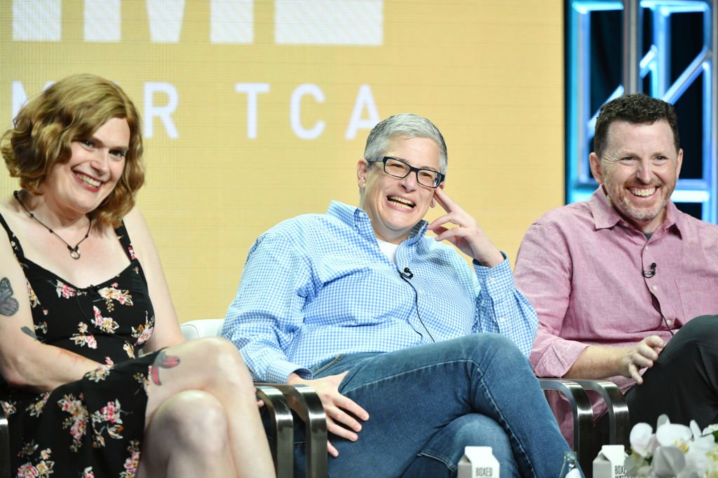 Image Credits: Getty Images / Amy Sussman | (L-R) Lilly Wachowski, Abby McEnany and Tim Mason of Work In Progress speak during the Showtime segment of the 2019 Summer TCA Press Tour at The Beverly Hilton Hotel on August 2, 2019 in Beverly Hills, California.