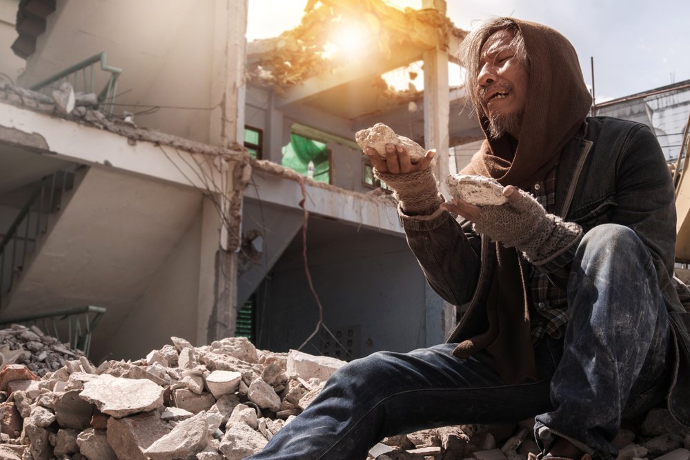 Man in an abandoned building destroyed | Shutterstock
