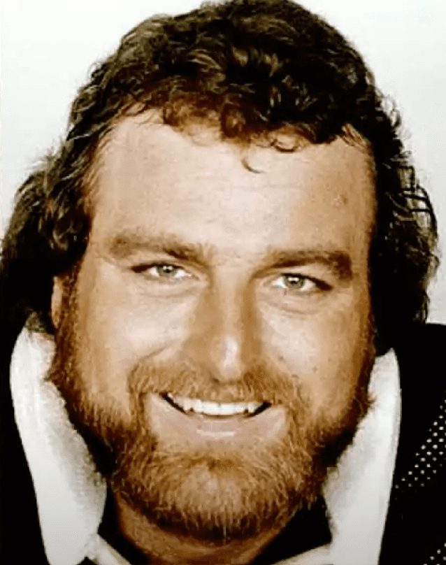 Image Source: Youtube/ai.pictures| John smiling during his NFL days