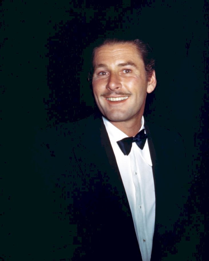 Image Credit: Getty Images // Errol Flynn at an event.