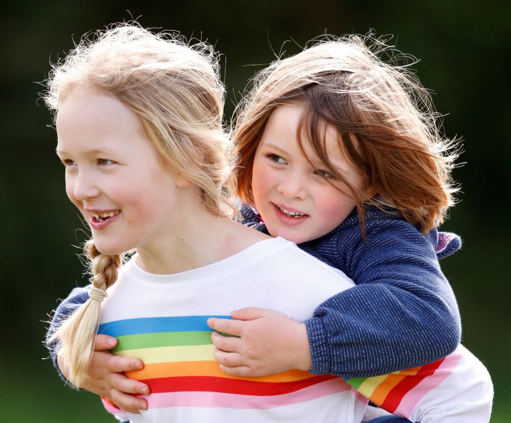Image Credit: Getty Images / Savanah Phillips gives her cousin Mia Tindall a piggyback as they attend the Gatcombe Horse Trials on March 23, 2019 in Stroud, England. Image Credit: Getty Images / Savanah Phillips gives her cousin Mia Tindall a piggyback as they attend the Gatcombe Horse Trials on March 23, 2019 in Stroud, England.