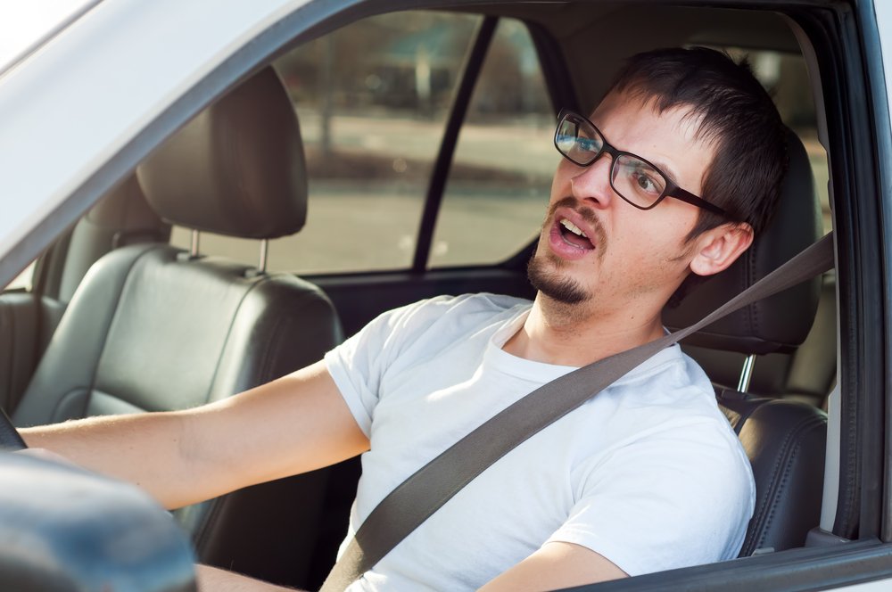 Man stunned by how driver in front is driving | Unsplash Man stunned by how driver in front is driving | Unsplash