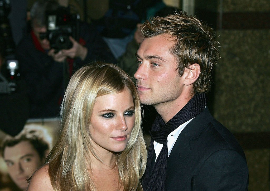 Image Source: Getty Images/Gareth Cattermole/Actors Jude Law and Sienna Miller arrive at the World Premiere of "Alfie" at the Empire Leicester Square on October 14, 2004 in London