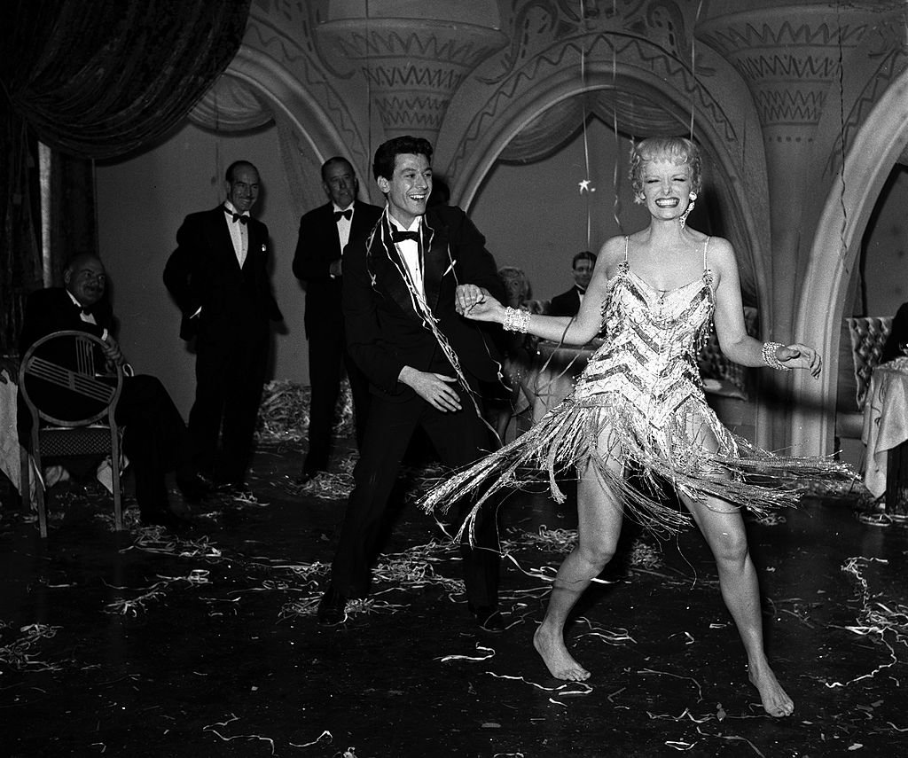 Image Source: Getty Images/Popperfoto/A scene from the film "Gentlemen Marry Brunettes" starring Jane Russell (right)