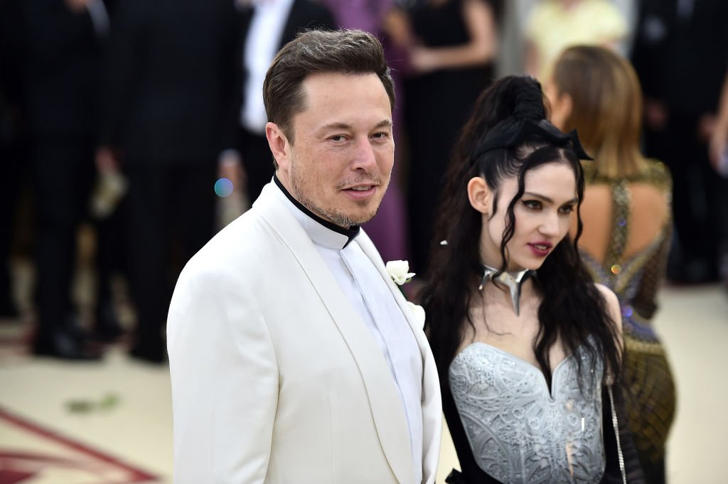 Image Credit: Getty Images / Elon Musk and Grimes attend the Heavenly Bodies: Fashion & The Catholic Imagination Costume Institute Gala at The Metropolitan Museum of Art on May 7, 2018 in New York City.