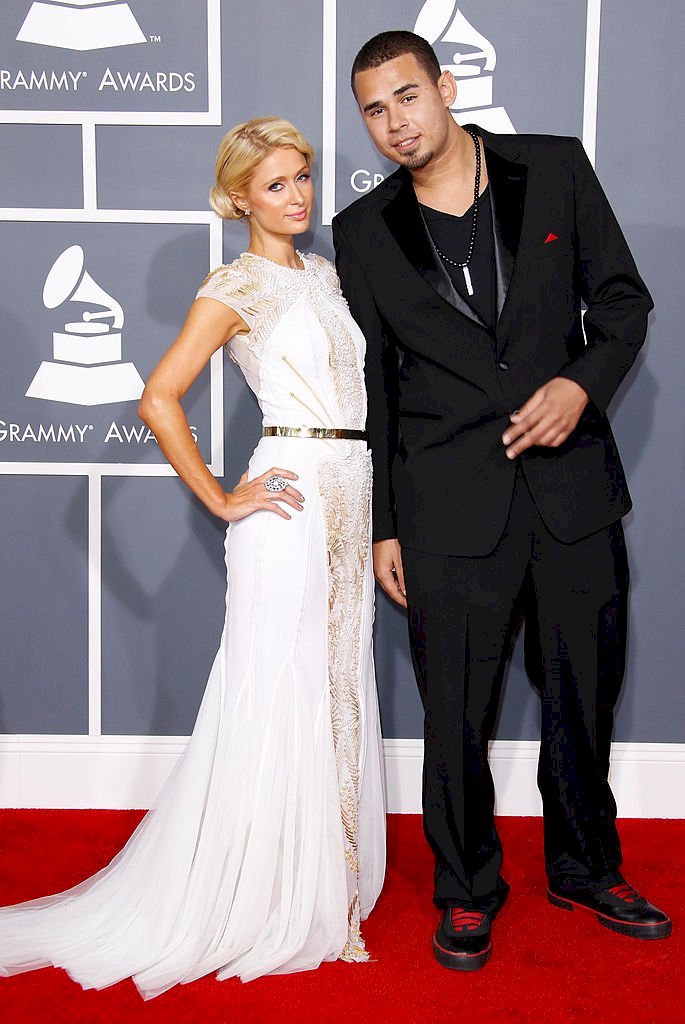 Image Credits: Getty Images / Dan MacMedan / WireImage | Paris Hilton (L) and Afrojack arrive at the 54th Annual GRAMMY Awards held at the Staples Center on February 12, 2012 in Los Angeles, California.