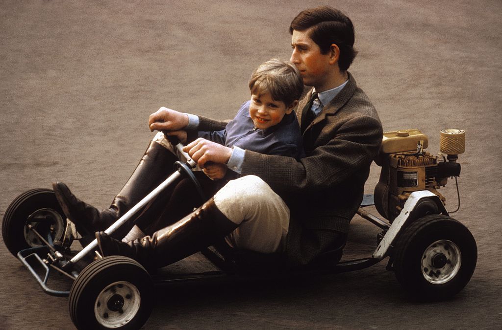 Image Credit: Getty Images / Prince Charles and his youngest brother Prince Edward go for a spin in their go-kart on the grounds of Windsor Castle in May 1969 near Windsor, Berkshire, England.