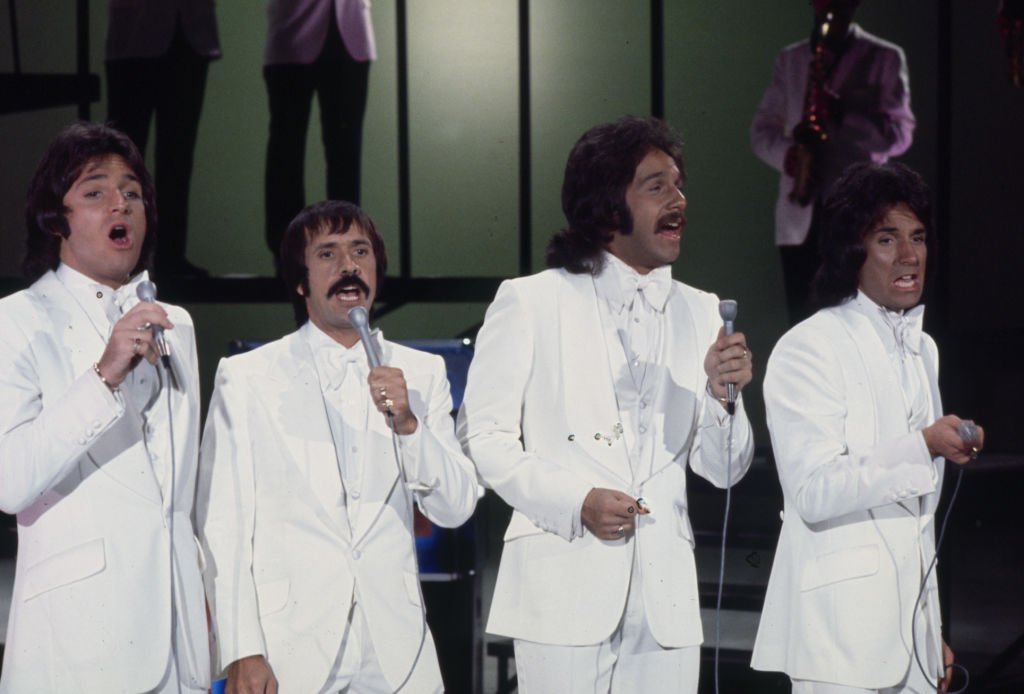 Image Credits: Getty Images / Walt Disney Television | Brett Hudson, Sonny Bono, Mark Hudson, Bill Hudson, the Hudson Brothers appearing on the ABC tv series 'The Sonny Comedy Revue'.