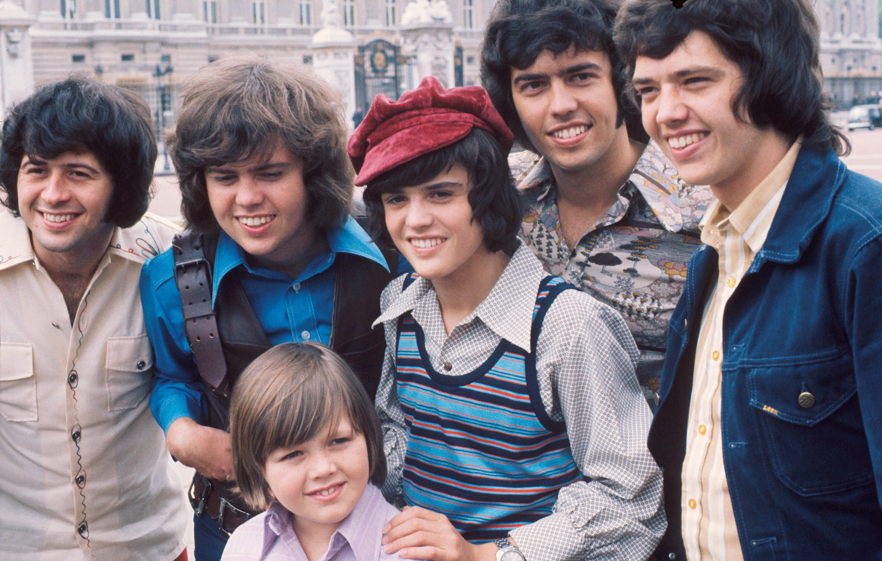Image Credits: Getty Images / Michael Putland | The Osmonds, group portrait, London, 1973, L-R Wayne Osmond, Merrill Osmond, Jimmy Osmond, Donny Osmond, Alan Osmond, Jay Osmond.