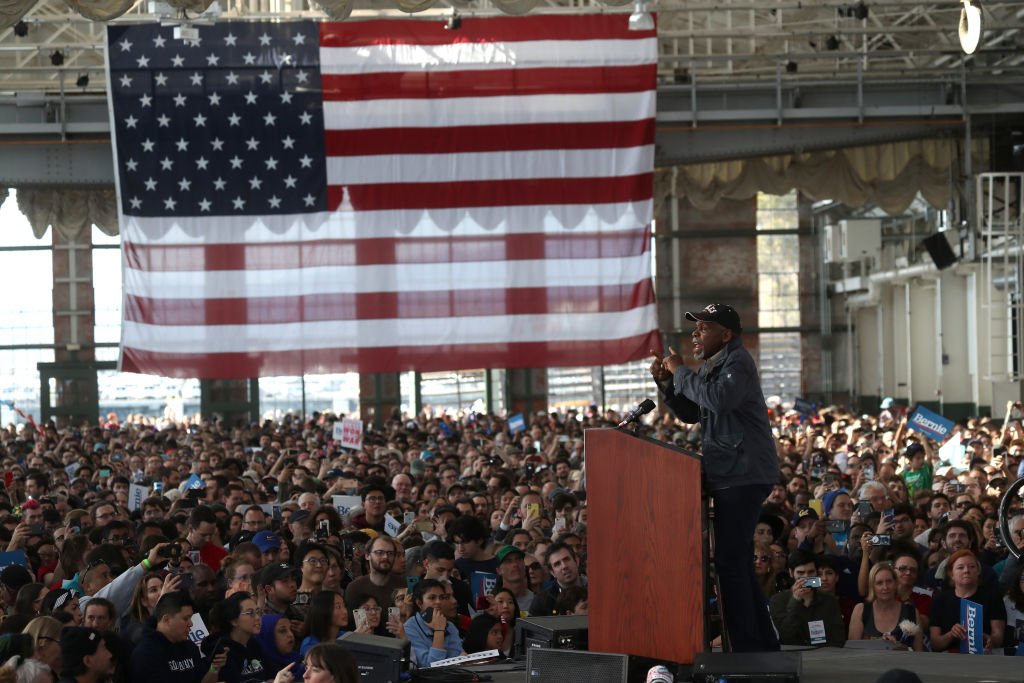 Image Source: Getty Images/Justin Sullivan| Actor Danny Glover speaks before the start of a campaign event with Democratic presidential candidate Sen. Bernie Sanders (I-VT) on February 17, 2020 in Richmond, California. Image Source: Getty Images/Justin Sullivan| Actor Danny Glover speaks before the start of a campaign event with Democratic presidential candidate Sen. Bernie Sanders (I-VT) on February 17, 2020 in Richmond, California.