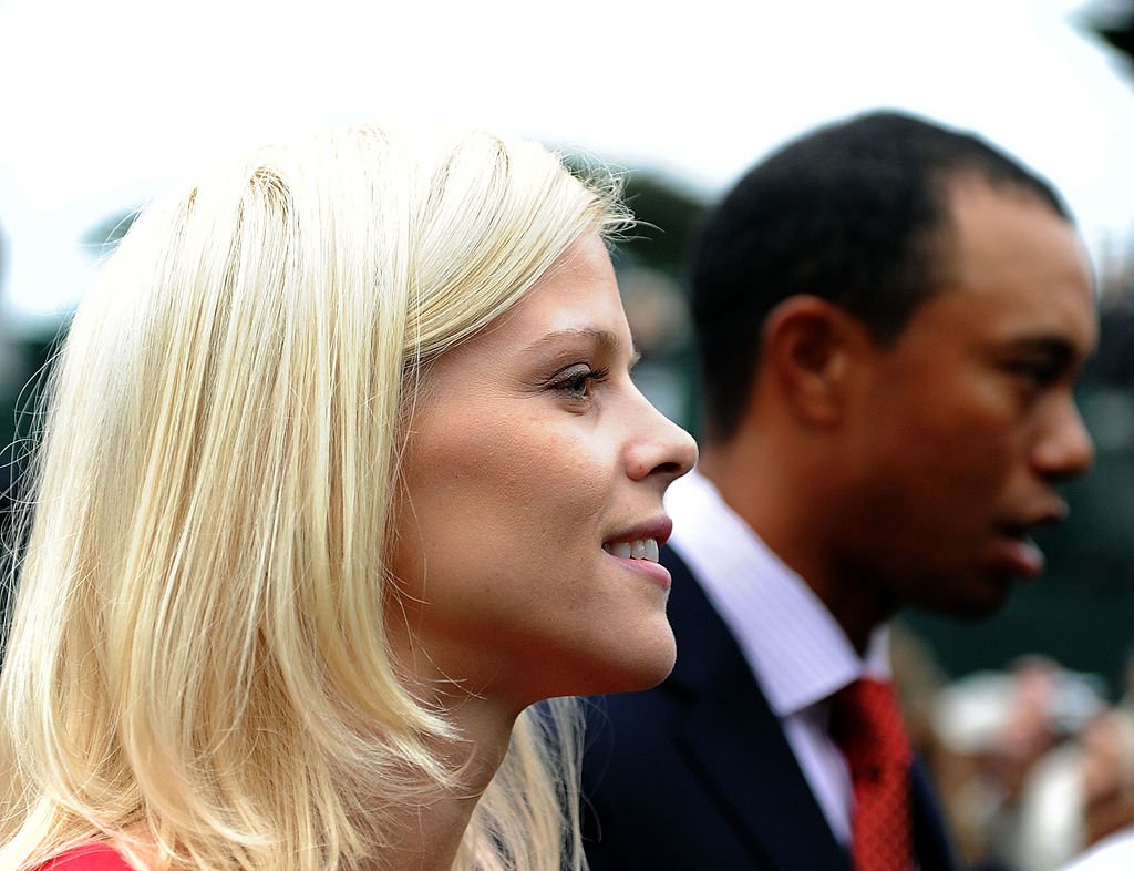 Image Credits: Getty Images / Harry How | Elin Woods and husband Tiger Woods exit during Opening Ceremony of The Presidents Cup at Harding Park Golf Course on October 7, 2009 in San Francisco, California. Image Credits: Getty Images / Harry How | Elin Woods and husband Tiger Woods exit during Opening Ceremony of The Presidents Cup at Harding Park Golf Course on October 7, 2009 in San Francisco, California.