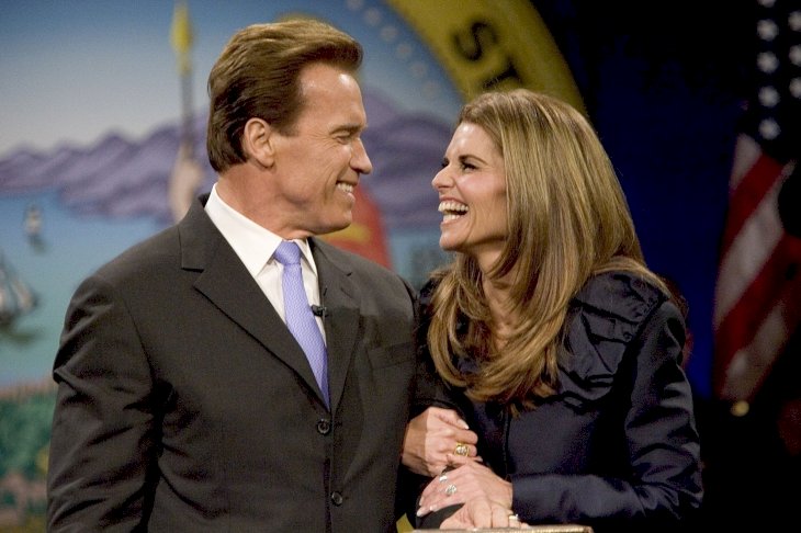 Image Credit: Getty Images/David Paul Morris | Former California Governor Arnold Schwarzenegger smiles at his ex-wife Maria Shriver