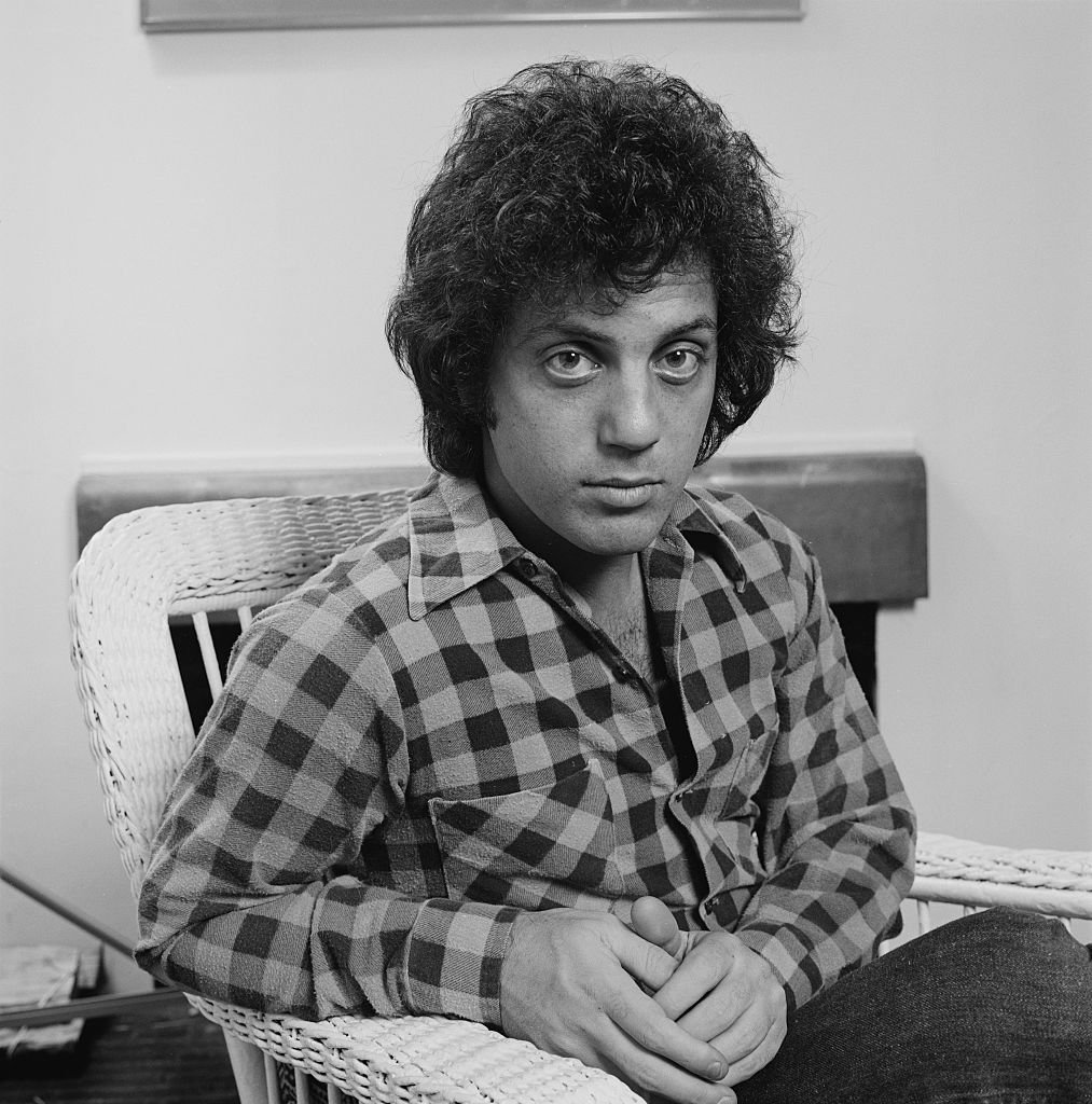 Image Credits: Getty Images / Michael Putland | American singer-songwriter Billy Joel, at his home in New York City, 25th January 1978. Image Credits: Getty Images / Michael Putland | American singer-songwriter Billy Joel, at his home in New York City, 25th January 1978.