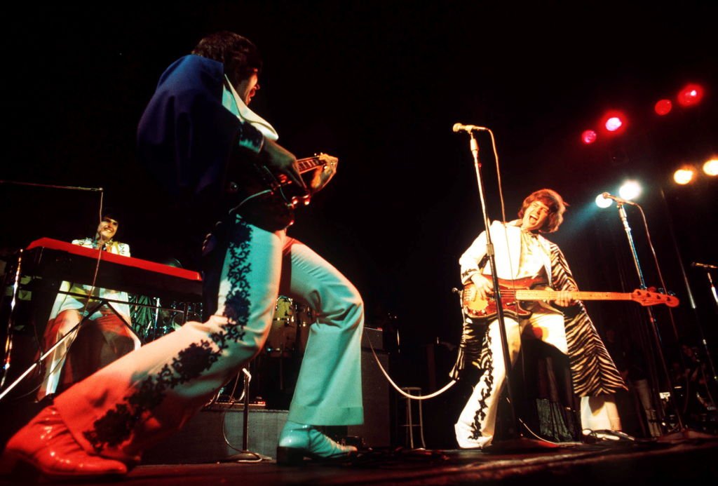 Image Credit: Getty Images / The Osmonds perform on stage, London, 1975, L-R Donny Osmond, Alan Osmond, Merrill Osmond.