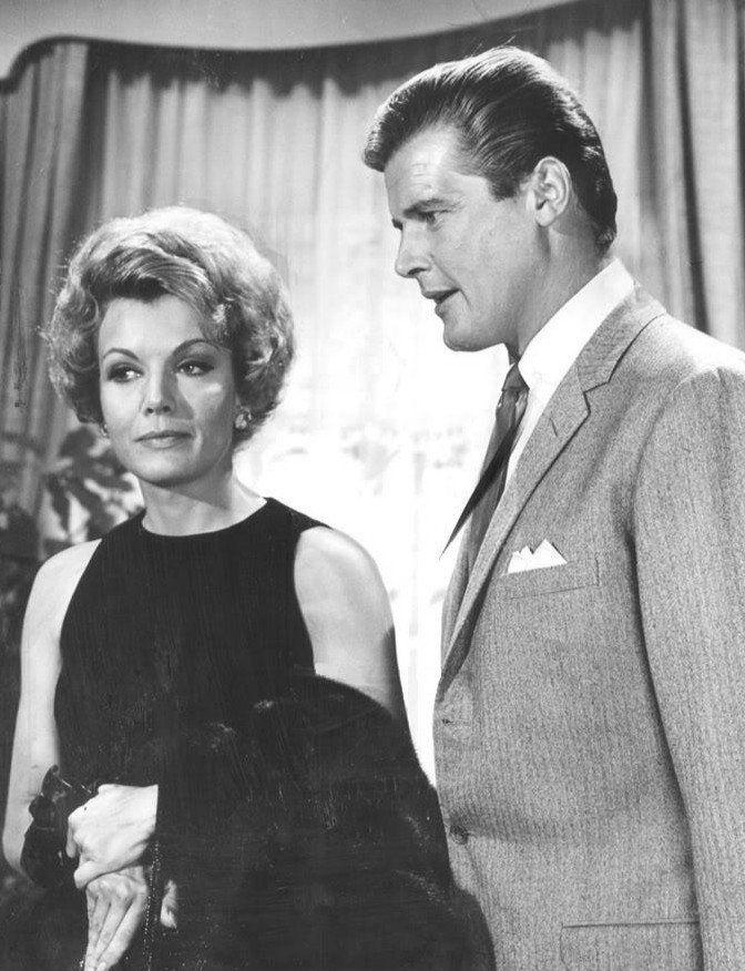 with Roger Moore | Image Source: Wikimedia Commons with Roger Moore | Image Source: Wikimedia Commons