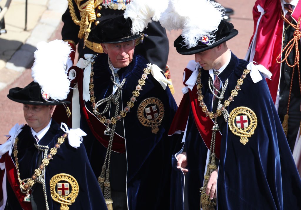 Image Credit: Getty Images / Prince Edward, Earl of Wessex, Prince Charles, Prince of Wales and Prince William, Duke of Cambridge march during the Order Of The Garter Service at Windsor Castle on June 18, 2018 in Windsor, England.