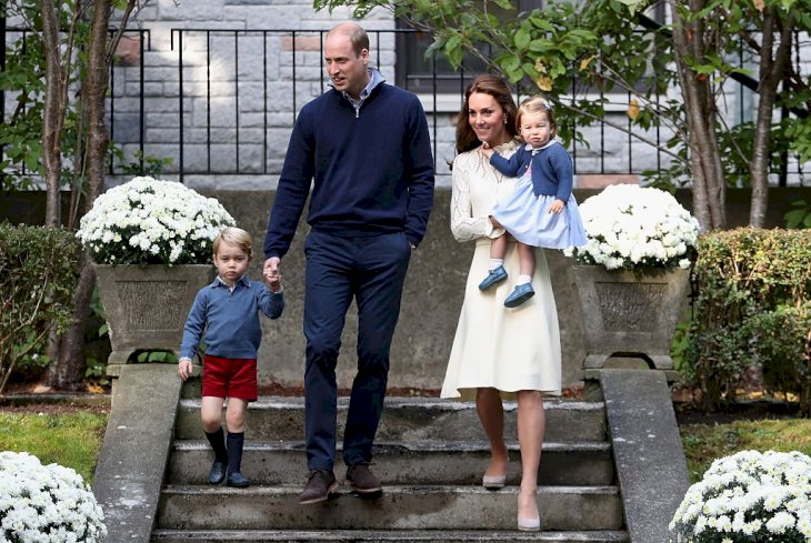 Image Credit: Getty Images / Catherine, Duchess of Cambridge, Princess Charlotte of Cambridge, Prince George of Cambridge and Prince William, Duke of Cambridge arrive for a children's party.