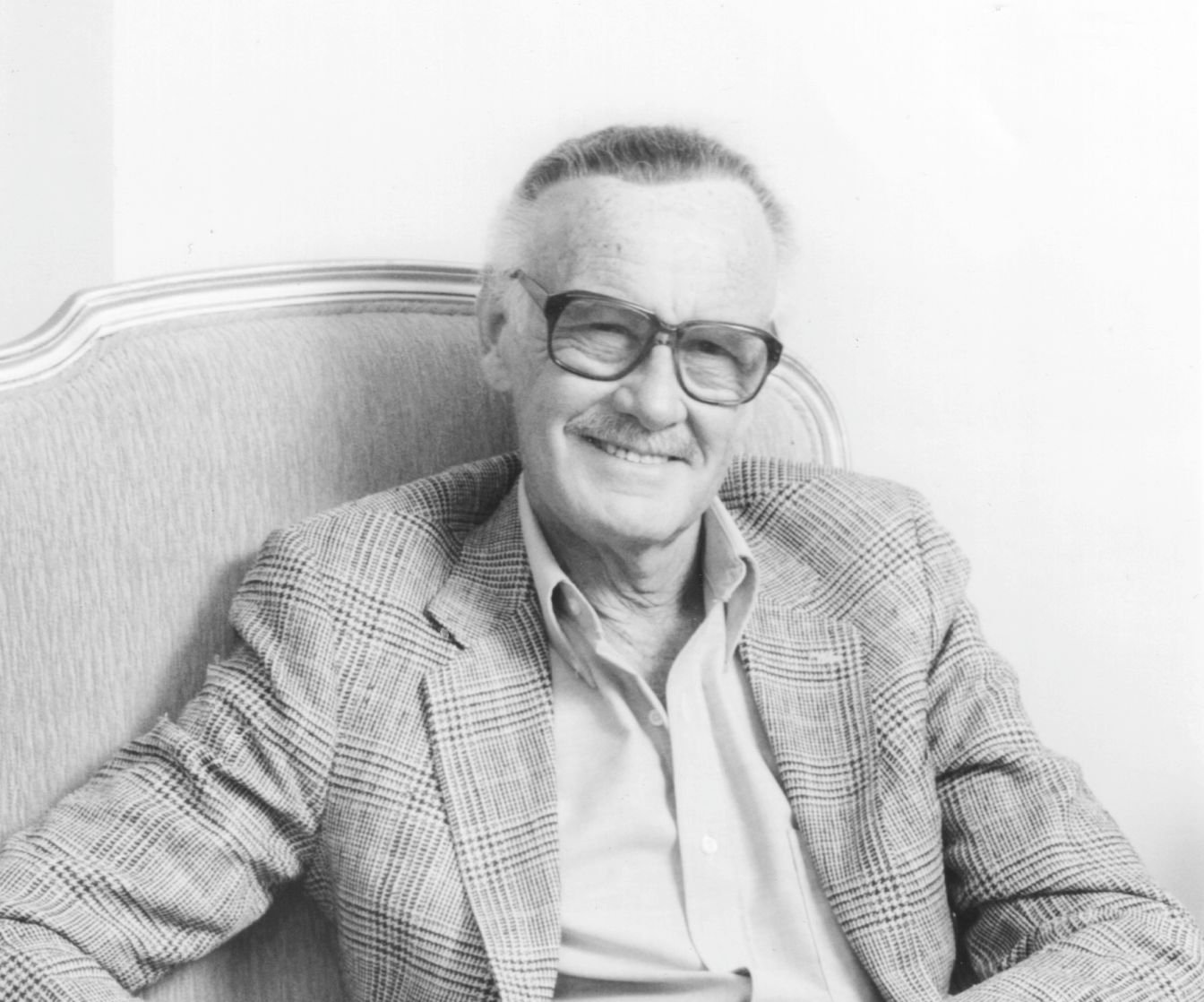 Image Credit: Getty Images / Comic book creator Stan Lee poses with a book celebrating 50 years of Marvel Comics at Helmsley Palace Hotel in New York.