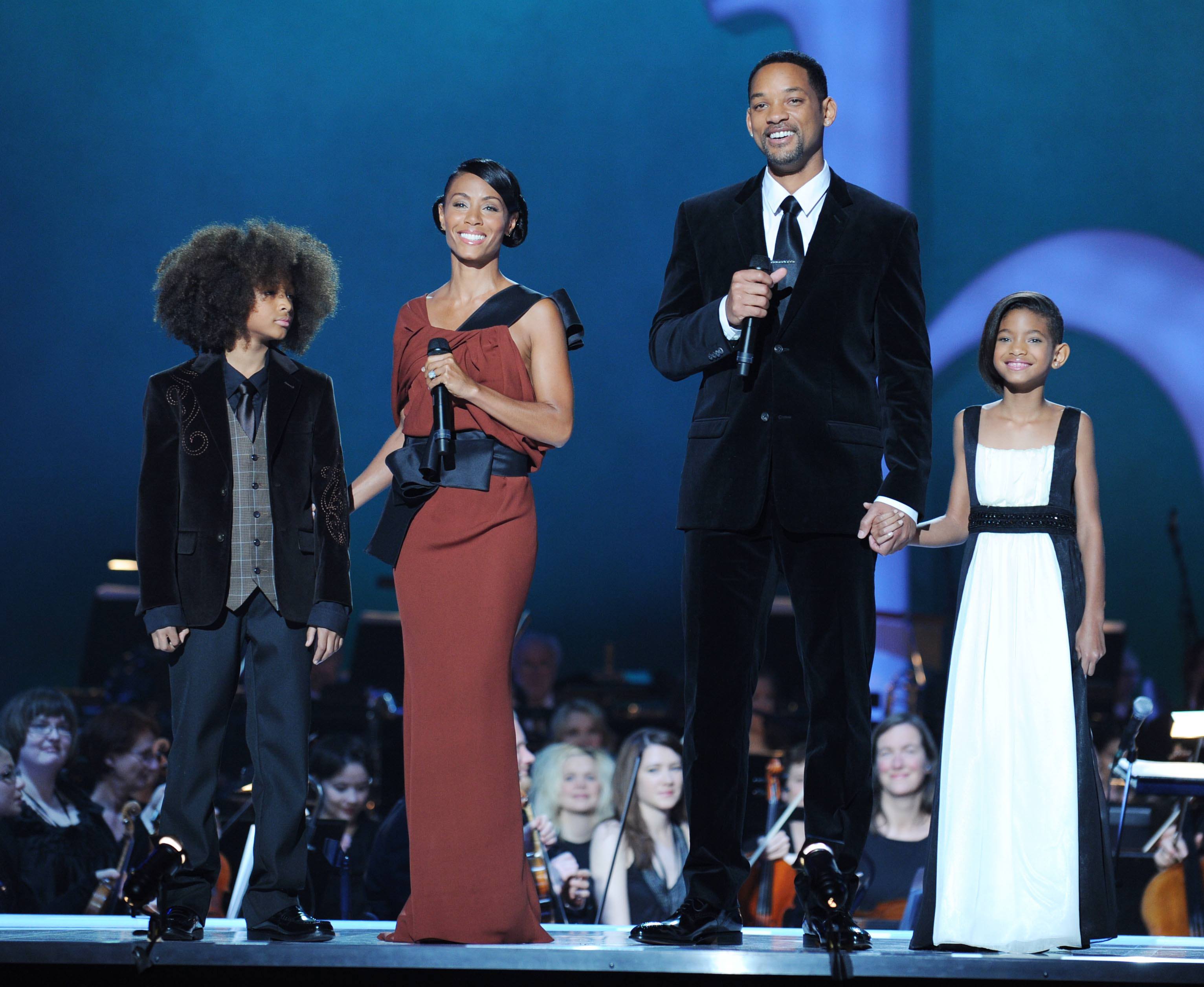 Image Credits: Getty Images / Sandy Young | Hosts Jade Pinkett Smith (2nd L) and Will Smith with children Jaden Smith (L) and Willow Smith (R) onstage during the Nobel Peace Prize Concert at Oslo Spektrum on December 11, 2009 in Oslo, Norway. Tonight's Nobel Peace Prize Concert is hosted by Will Smith and Jada Pinkett Smith and honours this year's Nobel Peace Prize winner US President Barack Obama. Image Credits: Getty Images / Sandy Young | Hosts Jade Pinkett Smith (2nd L) and Will Smith with children Jaden Smith (L) and Willow Smith (R) onstage during the Nobel Peace Prize Concert at Oslo Spektrum on December 11, 2009 in Oslo, Norway. Tonight's Nobel Peace Prize Concert is hosted by Will Smith and Jada Pinkett Smith and honours this year's Nobel Peace Prize winner US President Barack Obama.