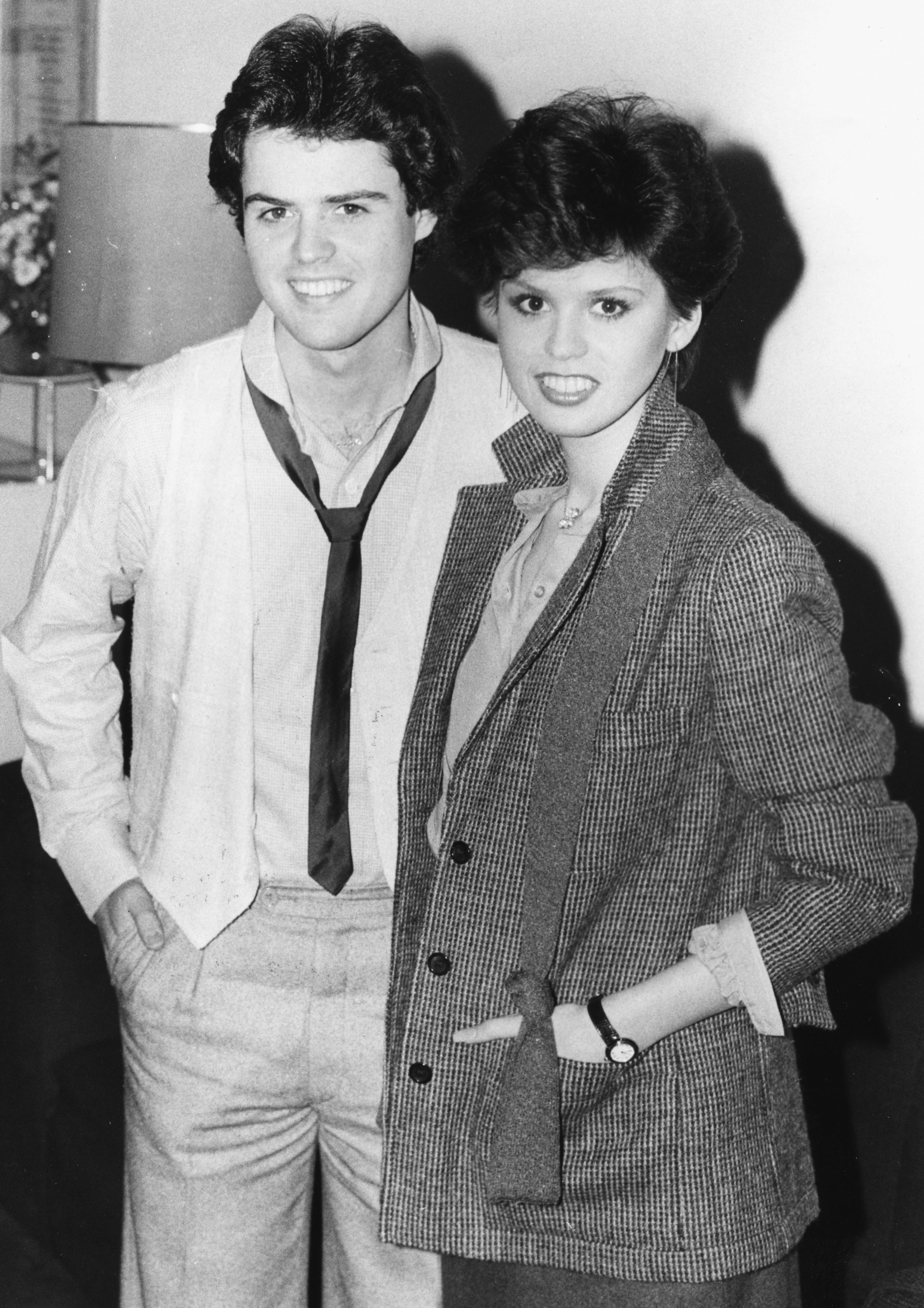 Image Credits: Getty Images / Monti Spry / Central Press | Singers and siblings Donny and Marie Osmond, smiling for the cameras at a press conference, London, January 22nd 1979.