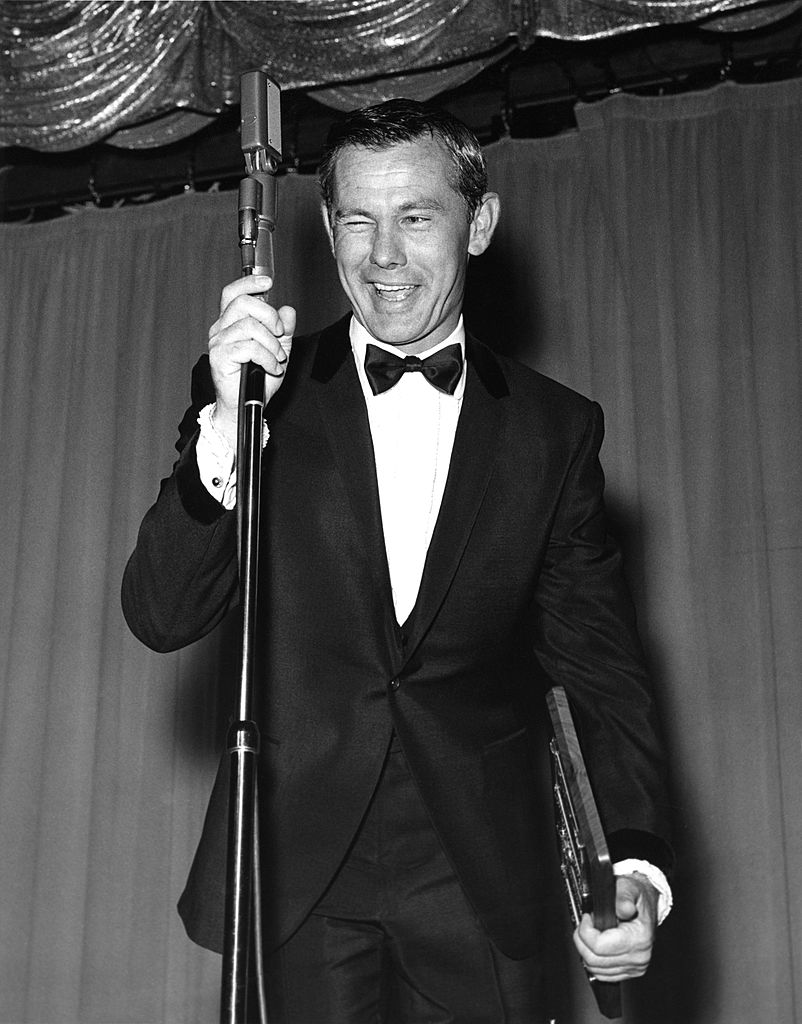 Image Credits: Getty Images / Michael Ochs Archives | Johnny Carson host of the Tonight Show, performs at the Sahara Hotel circa 1965 in Las Vegas, Nevada.