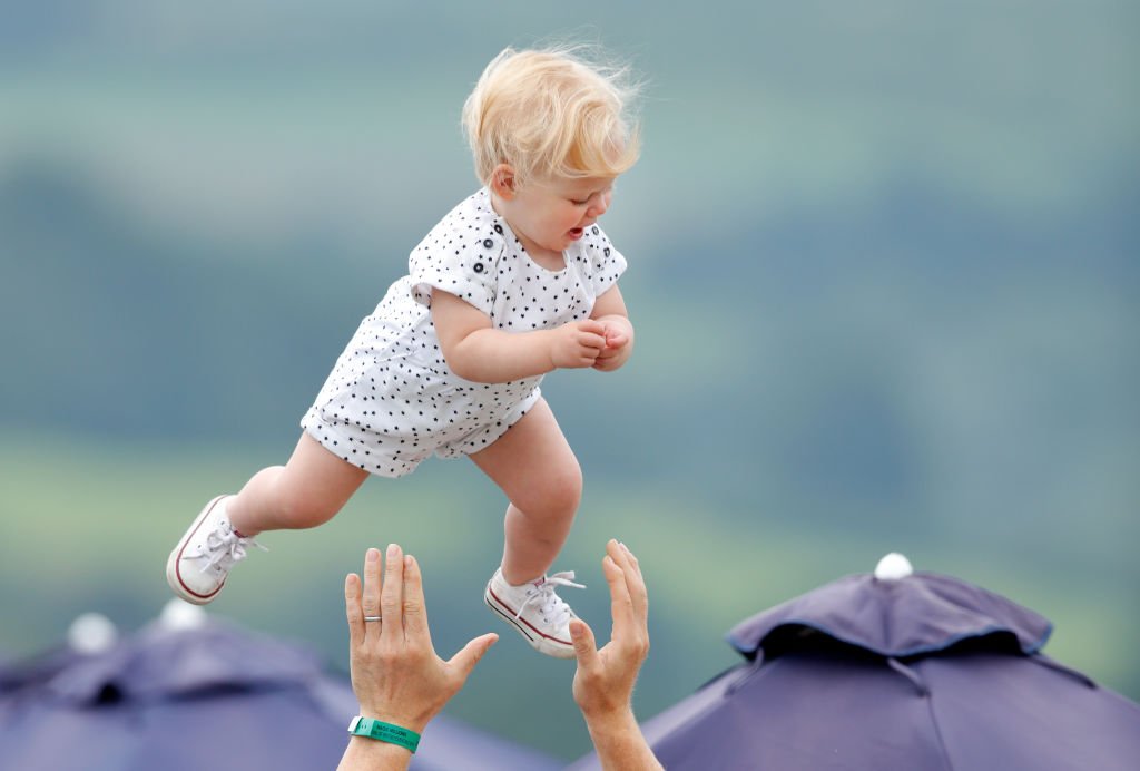 Image Credit: Getty Images / Mike Tindall throws daughter Lena Tindall into the air at Gatcombe Park on August 4, 2019 in Stroud, England. Image Credit: Getty Images / Mike Tindall throws daughter Lena Tindall into the air at Gatcombe Park on August 4, 2019 in Stroud, England.