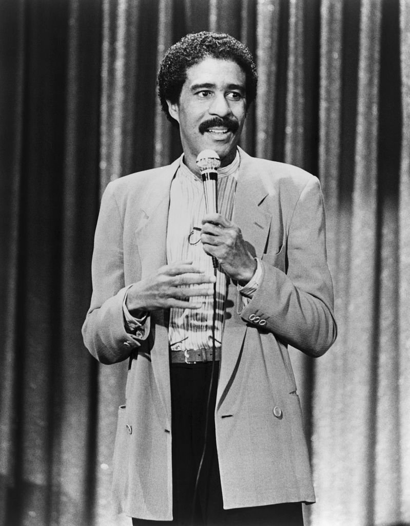 Image Credits: Getty Images / Bettmann | Richard Pryor performs his stand-up comedy routine in a scene from his 1982 movie "Richard Pryor: Live on the Sunset Strip"