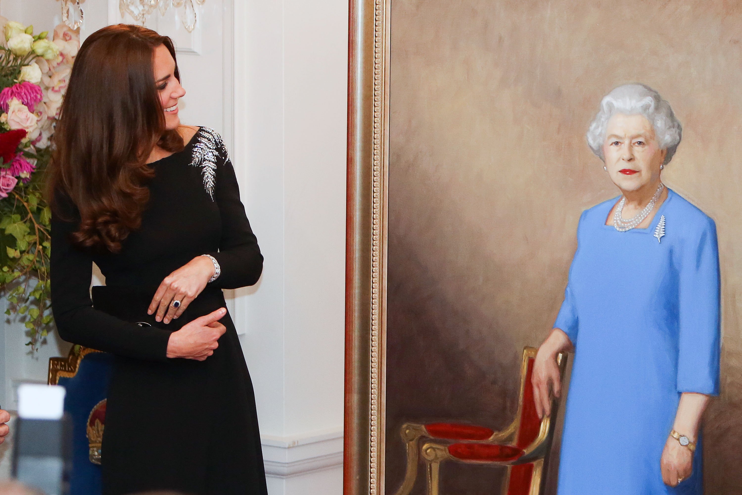 Image Credit: Getty Images / Catherine, Duchess of Cambridge inspects a portrait of Queen Elizabeth II, unveiled during a state reception at Government House on April 10, 2014 in Wellington, New Zealand.