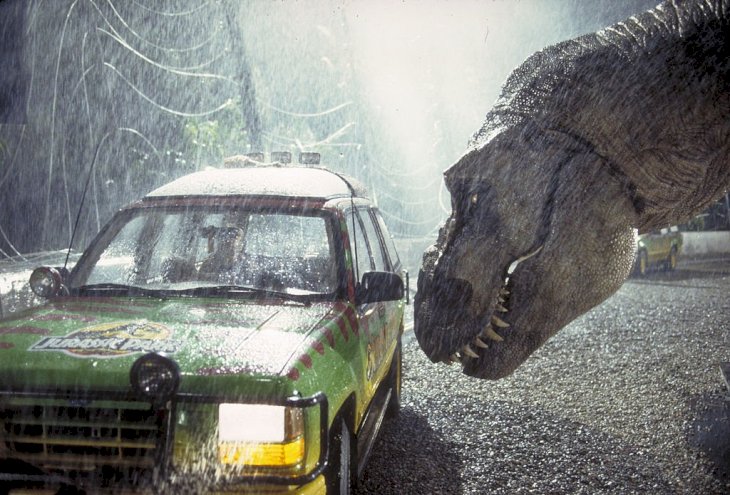 Image Credit: Getty Images/Murray Close | A Tyrannosaurus Rex menaces the theme park's first customers