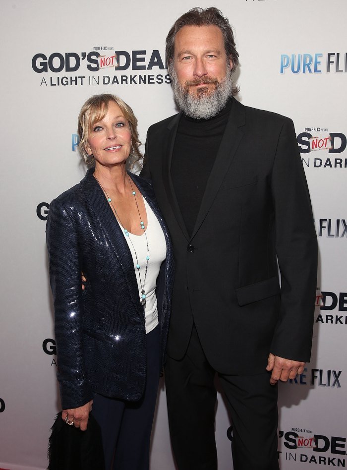 Image Credits: Getty Images / John Corbett and actress, Bo Derek poses for a photograph.