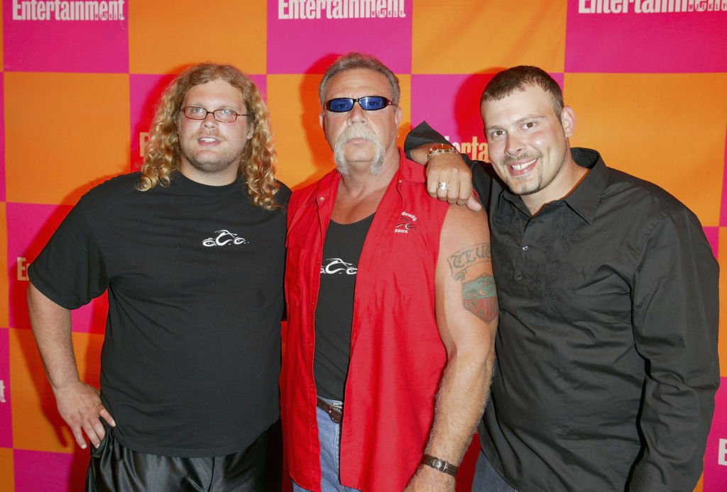 Image Credits: Getty Images / Matthew Peyton | American Chopper cast Mike Teutul, Paul Teutal Sr. and Paul Teutal Jr. arrive at the celebration of the "Must List: The 137 People & Things We Love This Summer" at CroBar June 17, 2004 in New York City.
