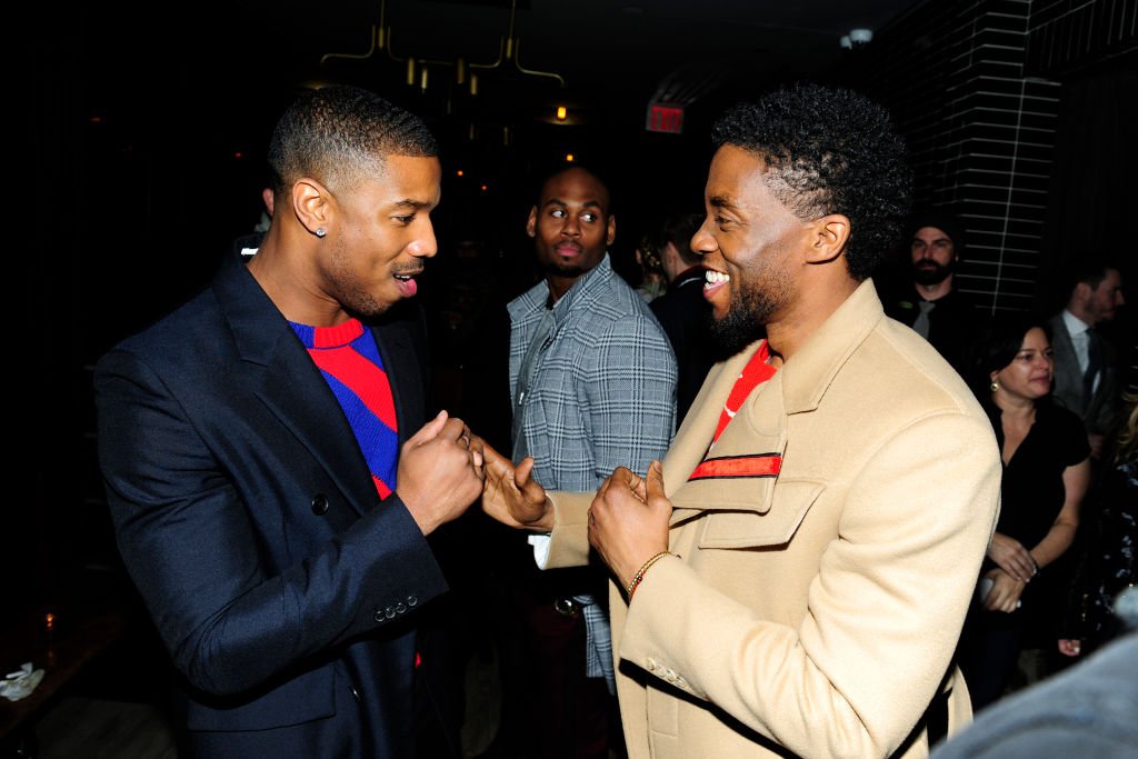 Image Credits: Getty Images / Paul Bruinooge / Patrick McMullan | Michael B. Jordan and Chadwick Boseman attend The Cinema Society with Ravage Wines & Synchrony host the after party for Marvel Studios' "Black Panther" at The Skylark on February 13, 2018 in New York City.