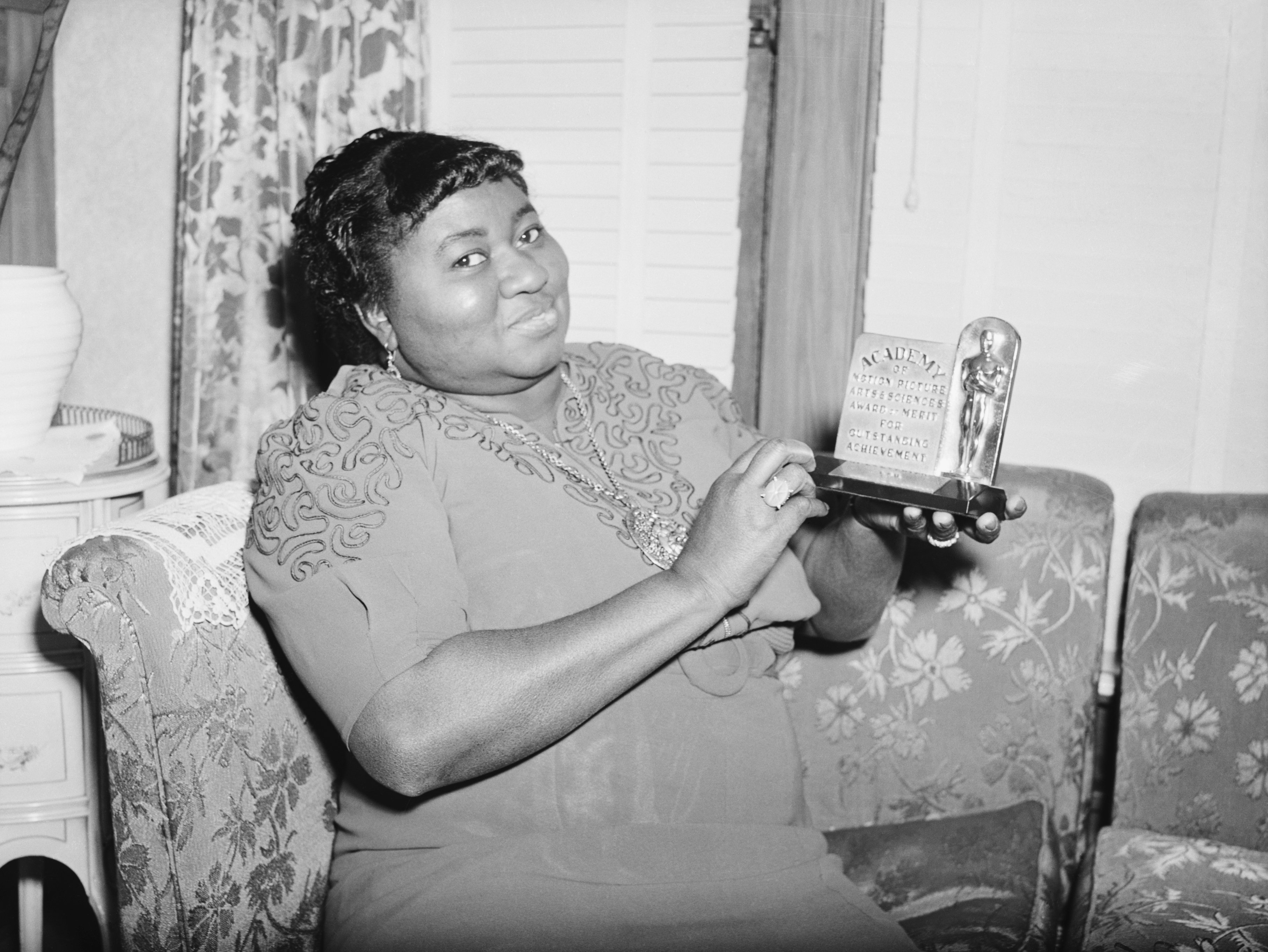 Image Credits: Getty Images / Bettmann | Actress Hattie Mc Daniel is shown with the statuette she received for her portrayal in "Gone With The Wind."