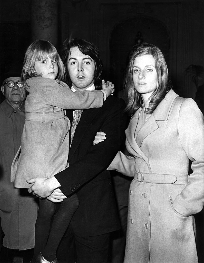 Image Credits: Getty Images / Cummings Archives / Redferns | Photo of Paul McCartney and Linda McCartney; posed with daughter Heather McCartney, on wedding day.