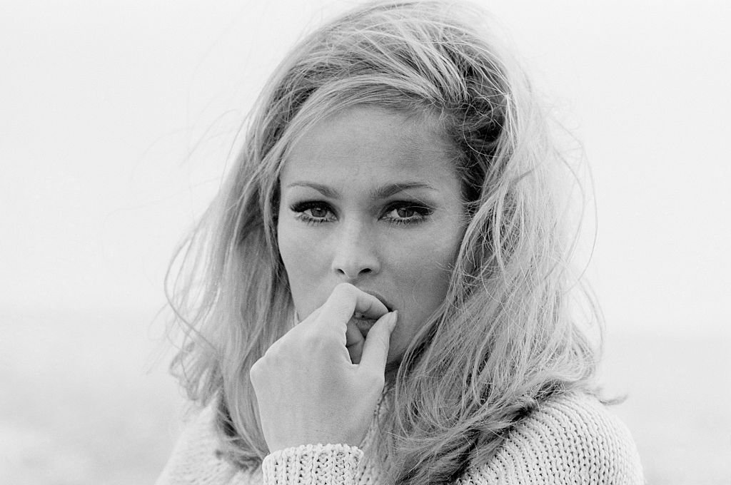 Image Source: Getty Images| Ursula posing wearing a turtle neck sweater Image Source: Getty Images| Ursula posing wearing a turtle neck sweater