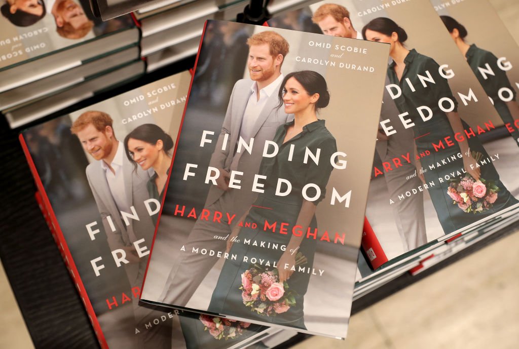 Image Credits: Getty Images / Chris Jackson | Copies of 'Finding Freedom' are stacked up in Waterstones Piccadilly on August 11, 2020 in London, England. Finding Freedom: Harry and Meghan and the Making of A Modern Family is a biography of Prince Harry and Meghan Markle, the Duke and Duchess of Sussex, written by Carolyn Durand and Omid Scobie and published by Harper Collins.