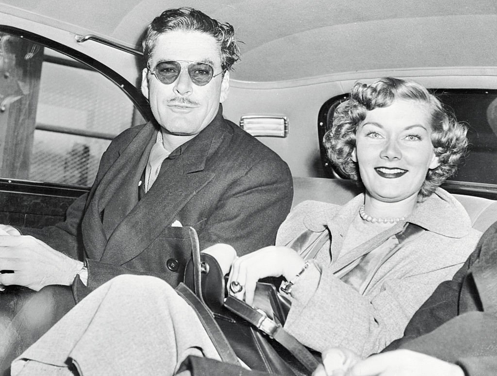 Image Source: Getty Images/Bettmann/Errol Gets Fair Consolation. New York: While his wife, Nora Eddington, is in Nevada preparing to unhitch her wagon from the star, Errol Flynn